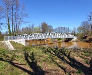 Bridge over river against clear sky