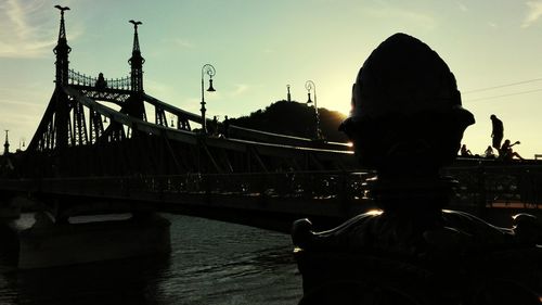 Silhouette of bridge against sky