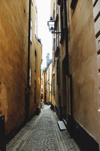 Narrow alley along buildings