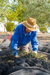 Rear view of man standing by plants