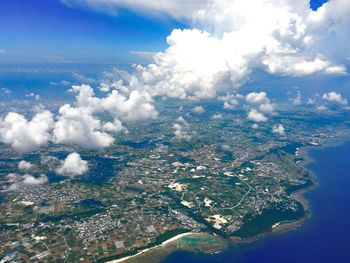 Aerial view of sea and landscape against sky