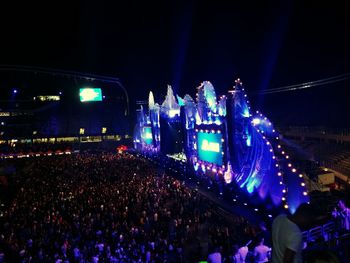 People enjoying music concert at night