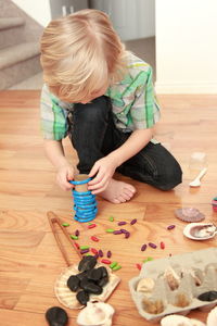 Cute girl playing with toy in background