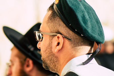 Close-up portrait of young man wearing sunglasses