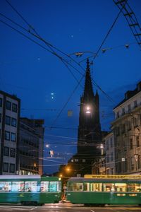 Illuminated city against sky at night