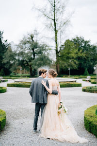 Full length of couple holding hands