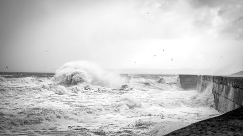 Waves breaking against sea