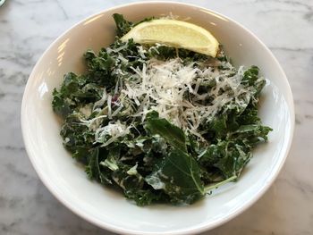 High angle view of kale caesar served on table