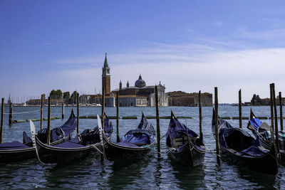 Gondolas at piazza san marco with san giorgio maggiore church - venice, veneto, italy