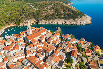 High angle view of townscape by sea