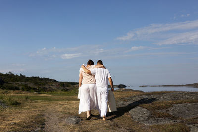 Rear view of couple walking together