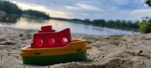 Close-up of toy on beach