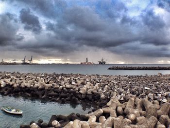 Scenic view of sea against cloudy sky