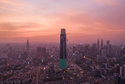 Cityscape against sky during sunset