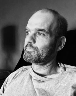 Close-up of thoughtful mature man relaxing at home