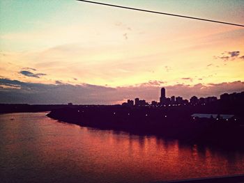 Scenic view of river at sunset