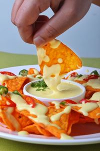 Close-up of hand holding food in plate