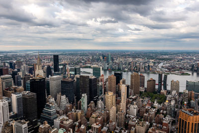 High angle view of modern buildings in city against sky