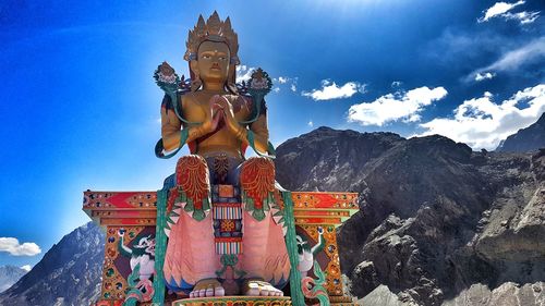 Low angle view of statue against sky