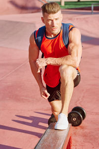 Full length of woman exercising in gym