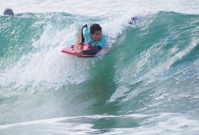 Man surfing on sea