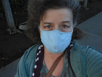 Portrait of woman standing outdoors