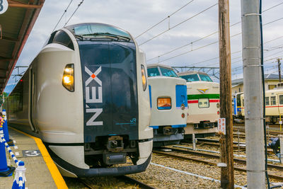 Train on railroad station against sky