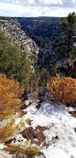 Scenic view of river against sky during winter