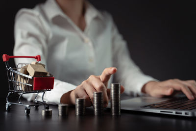 Midsection of woman working on table