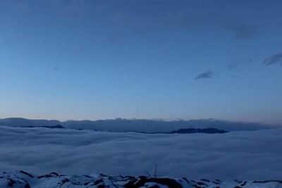 Scenic view of snow against clear blue sky