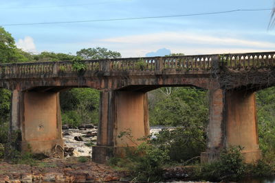 View of abandoned bridge against sky