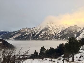 Scenic view of snowcapped mountains against sky