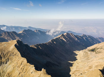 Panoramic view of rocky mountains against sky