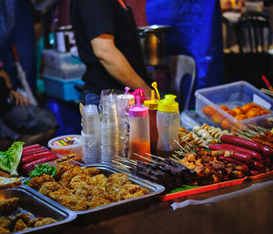 Midsection of food on table at market stall