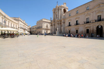 Group of people in front of historic building