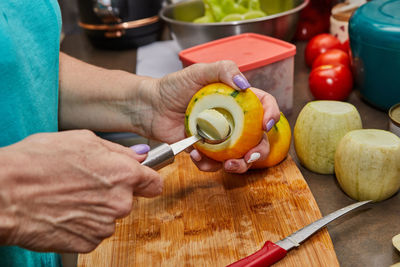 Cropped hand of man preparing food