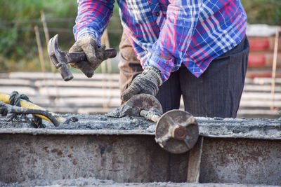 Man working on metallic structure