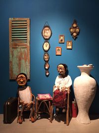 High angle view of people sitting on chair at home