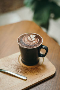 Hot cocoa mug on wooden table