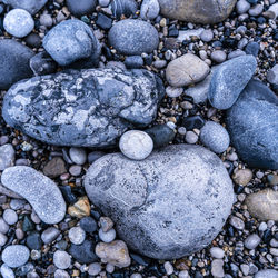 High angle view of stones on pebbles