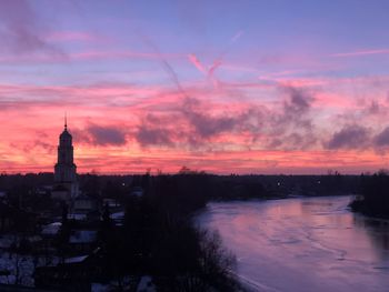 Buildings against sky during sunset