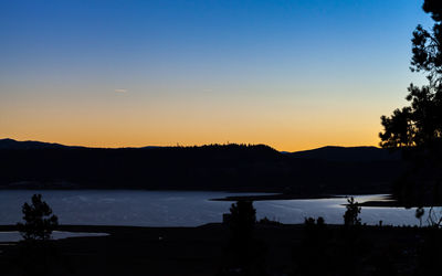 Scenic view of lake at sunset