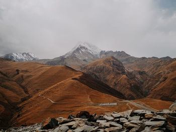 Scenic view of snowcapped mountains against sky