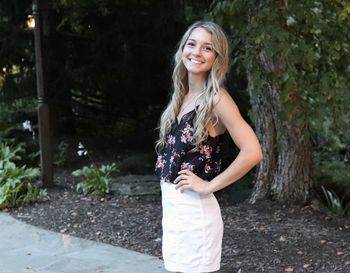 Portrait of a smiling young woman standing outdoors