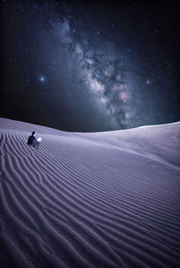 Scenic view of star field against sky at night