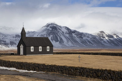 Black church of budir in iceland, springtime