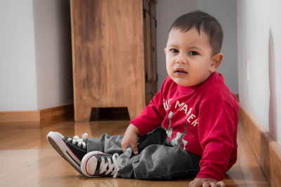 Boy sitting on sofa