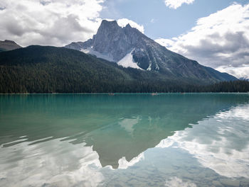 Volcano like shaped mountain reflected in pristine colorful lake. emerald lake, yoho np, bc, canada