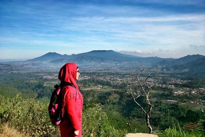 Woman looking at mountain landscape