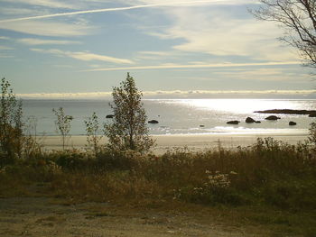 Scenic view of sea against cloudy sky